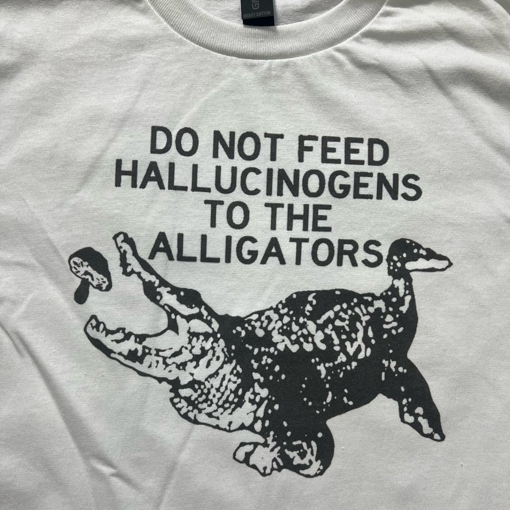 Do Not Feed Alligators funny weird White Unisex T-Shirt